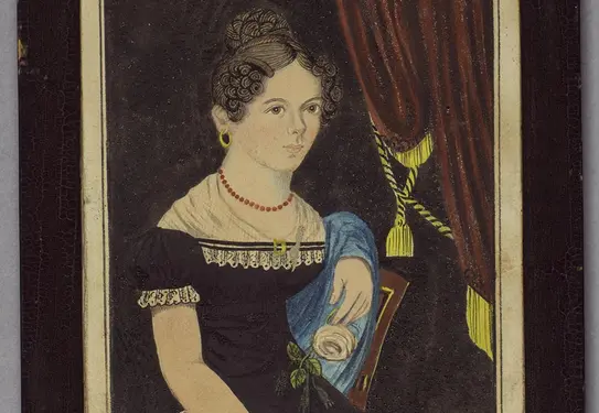 Portrait of a woman wearing a coral necklace, sitting next to red drapes with gold tassels.