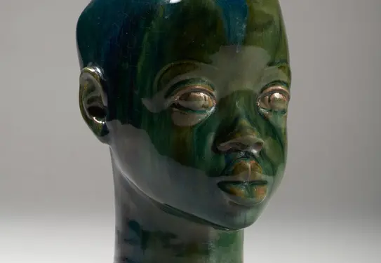  Glazed terracotta sculpture of a boy.