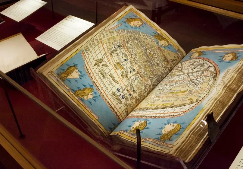 rare book opened to page of world map