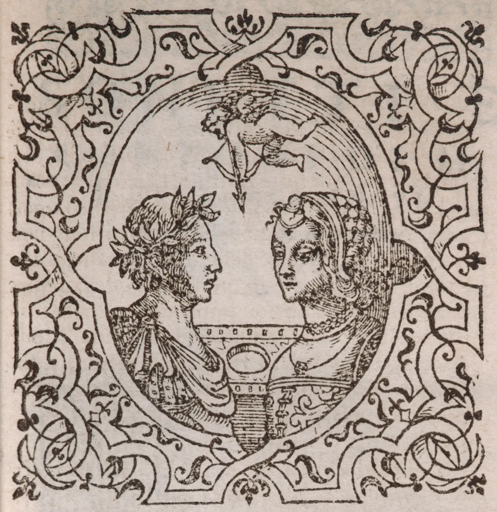 A woodcut print on a book page, depicting two people and Cupid surrounded by an ornate border.