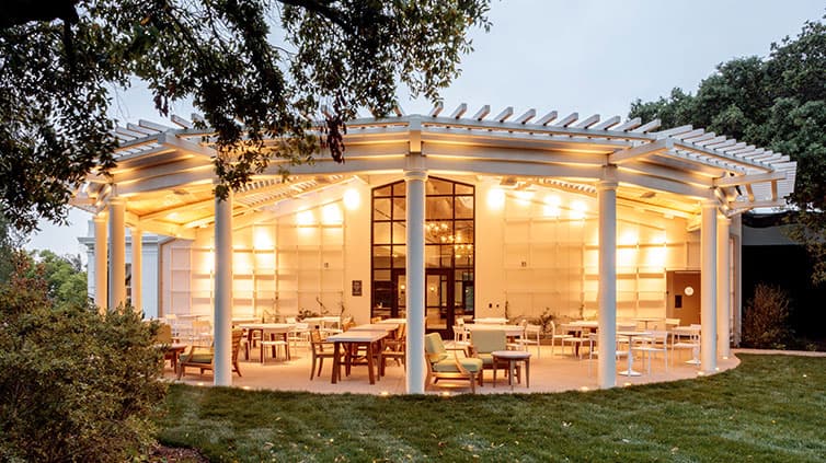 A tea room patio is lit up at dusk.