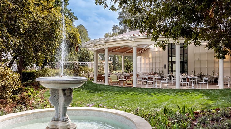 A 17th century fountain reveals a covered patio in the background.