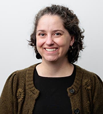 A person smiles for the camera.