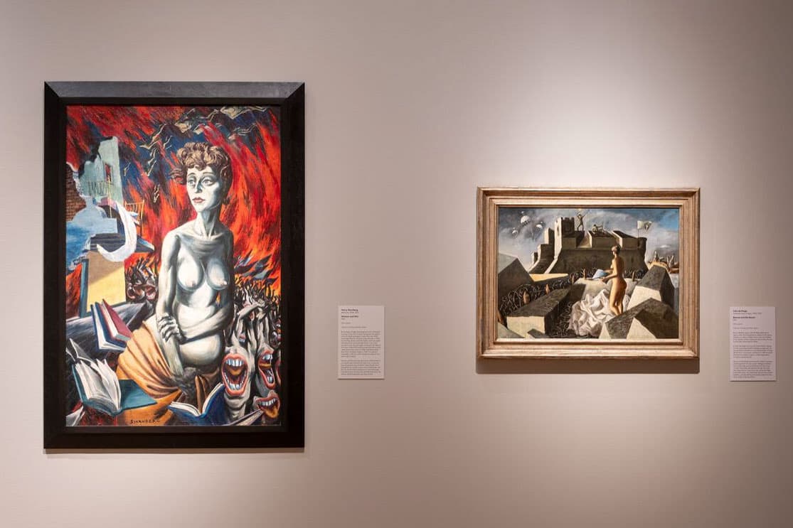 Two framed paintings on a wall.