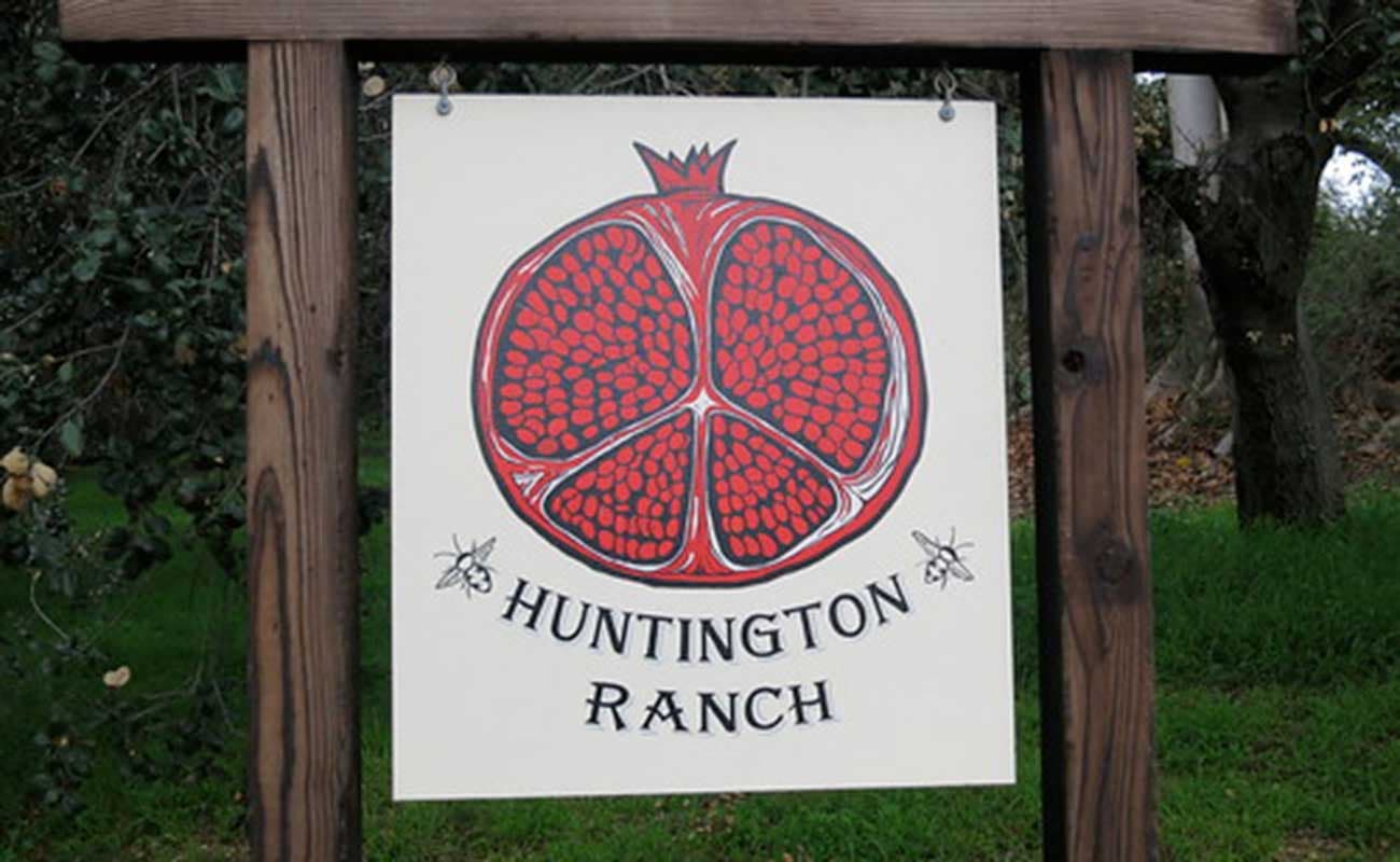Ranch Garden sign with illustrated pomegranate 