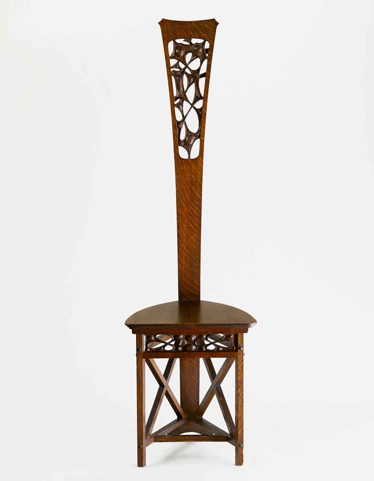 Charles Rohlfs (American, 1853-1936) and Anna Katharine Green (American, 1846–1935), Desk Chair, ca. 1898–1899. From the Rohlfs home. Oak, 53 15/16 x 15 15/16 x 16 7/8 inches. Metropolitan Museum of Art, Promised Gift of American Decorative Art 1900 Foundation in honor of Joseph Cunningham. Photo by Gavin Ashworth © American Decorative Art 1900 Foundation.