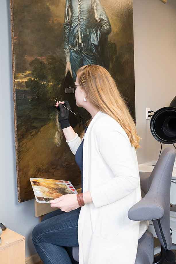 Christina Milton O’Connell, Mary Ann and John Sturgeon Senior Paintings Conservator, inpainting in the conservation lab. The Huntington Library, Art Museum, and Botanical Gardens.