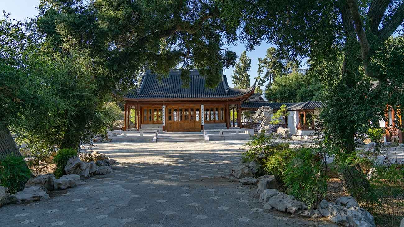 Mature oaks frame a view of the Courtyard of Assembled Worthies and the Flowery Brush Library, two of the new features in the expanded Chinese Garden. Photo by Aric Allen. The Huntington Library, Art Museum, and Botanical Gardens.
