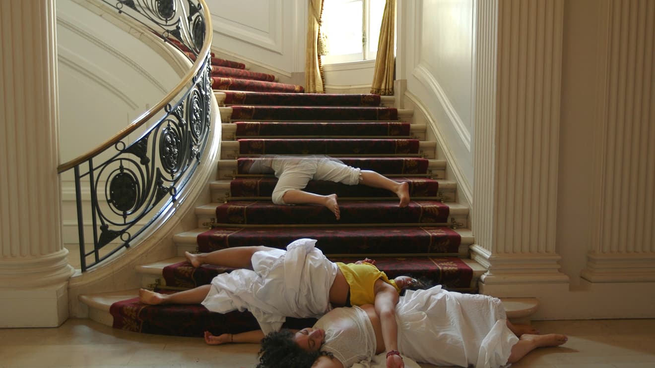 Performers sprawled on staircase