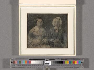Portrait of two unidentified women, one younger and one older with glasses