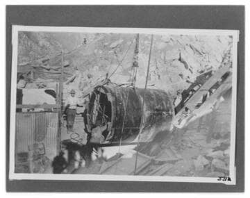 The penstock at the top of the hoist line about to be lowered into the tunnel at Kern River #1 Hydro Plant