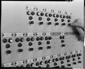 Close-up of finger on relay button for 4kV Bus