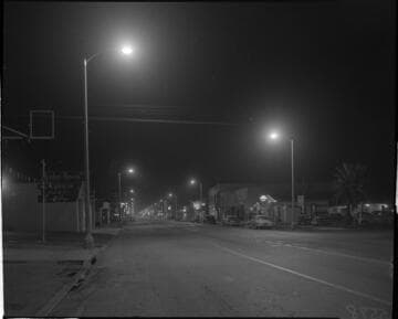 Street lighting at night in a business district near Mission Ave