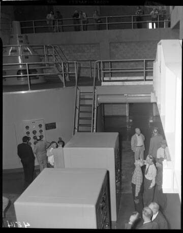 Group touring the interior of the newly operating Big Creek Powerhouse #4 with its two vertical axis, Francis turbine generators