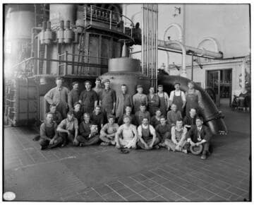 Group photo of Long Beach Steam Plant employees in the Engine Room at LBSP