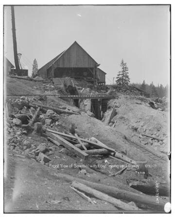 Big Creek Huntington Lake Dams - Front view of sawmill with logs going up logway. Job H