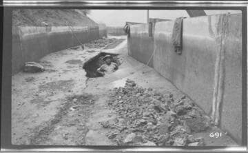 A man standing in the first break in the ditch at Kaweah #3 Hydro Plant