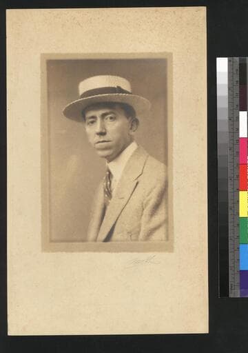 Portrait of Carl Moon wearing a straw hat