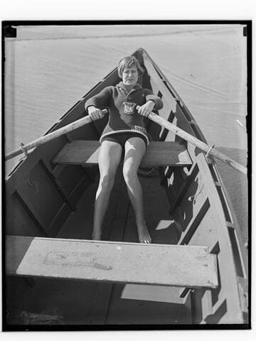 Lily May Bowmer rowing a boat at the beach, Santa Monica, California