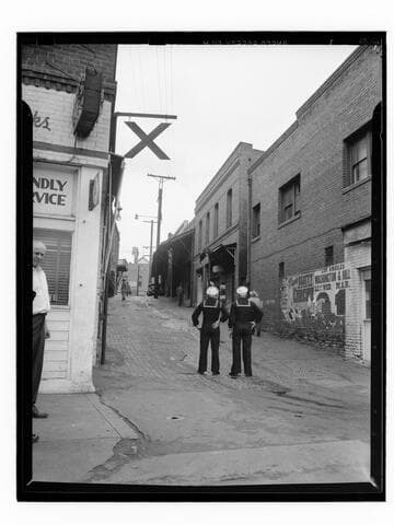 Sailors standing in an alley, Los Angeles