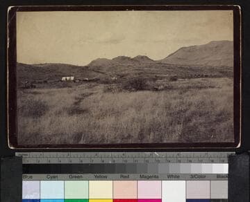 General Crook's camp in or near the Canon de los Embudos. To the right of the tent is the historic whiskey mill, while at the extreme right appears the camp of the Apache scouts in Crook's employ