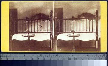 Bed of Lincoln in his chamber, bouquet of flowers in the glass that lay on his breast in the Coffin