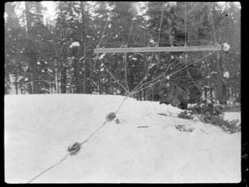 Powerpole crossarm down in snow