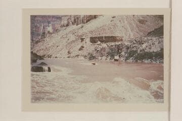 Approach of inboard motor boat to Vulcan Rapid. Piloting is Dock Marston and Willie Taylor with Joe Desloge are the passengers