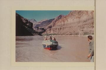 Buzz Belknap handling the "Bootoo" at Whitmore Beach. Bill Beer is at right