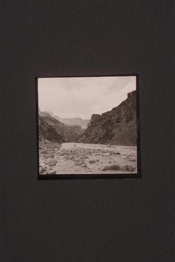 Boat pulling in at lower end of Hermit Rapid. Jack Couffer is making motion pictures at left as Ed Ralph stumbles along the shore, right center