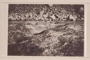 Frank Dodge in Hermit Creek Rapid. Cruise of the Carnegie Institution-Caltech party