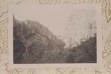 South to Ra-Osiris Saddle showing sheer drop at top of Redwall at head of gorge.  The Redwall climbing route follows vegetation left of center in photo and this is probably Stanton-Hislop-Kane descent route