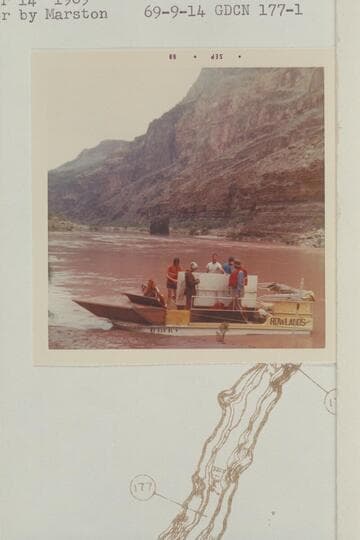 Deck boat ready for departure from camp at Mile 177.6 left bank.  The Lava Pinnacle, Vulcans Anvil is [sic] middle distance