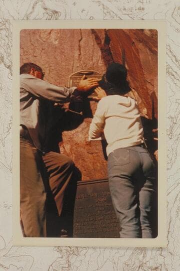 Jim Bailey and Frankie Strathairn fasten 1934 plaque at Separation Canyon