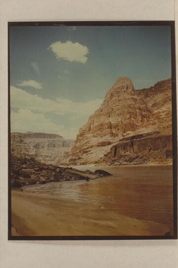 Upriver view from the lower end of the beach at Spring Canyon. Margaret Marston in swimming at the point in the foreground