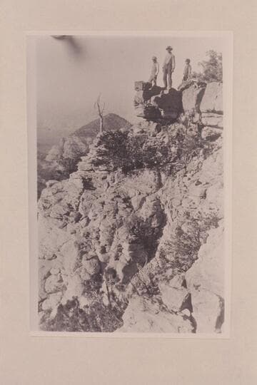 Marks, George and Charley Spencer on ledge of Navajo Mountain near Navajo Begay. On trek from Oljeto to Lees Ferry