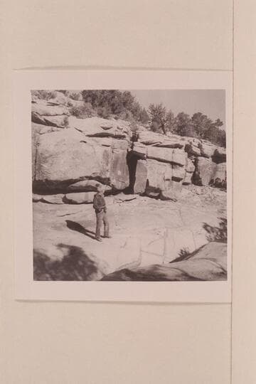 Mary Abbott looks at the inscription in the gorge below the Navajo Mt. Trading Post