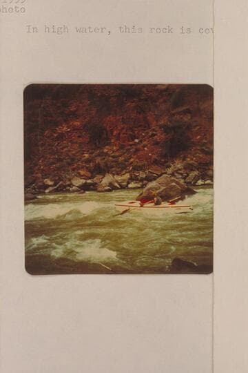 A. K. Reynolds passing the big rock at the lower end of Disaster Rapid. In high water, this rock is covered