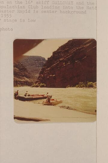Lug Larsen on the 16' skiff "Galloway" and the numerous members of the Appalachian Club loading into the Hatch pontoon. Lower Disaster Rapid is center background. The water stage is low