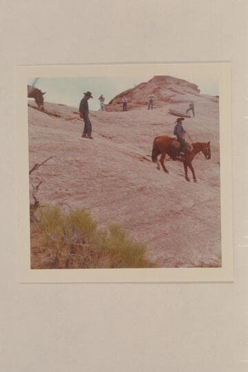 Dan Lehi rides down the slick rock and Toby Owl leads his mule while the dudes run cameras. The trail is between Bald Rock Creek and Nasja Creek
