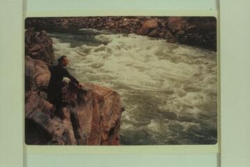 Jorgen Visbak look-sees 232 Mile Rapid before running it on an air mattress