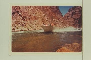 Buzz Belknap drives Mack Miller's Turbocraft up Gneiss Canyon Rapid