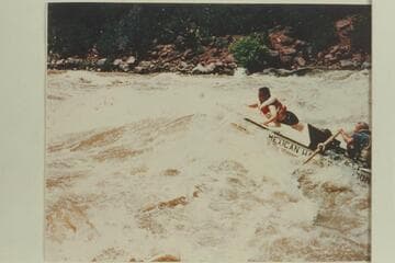 Wayne McConkie and Wilmer C. Bennett riding Upper Disaster Rapid, Mile 237