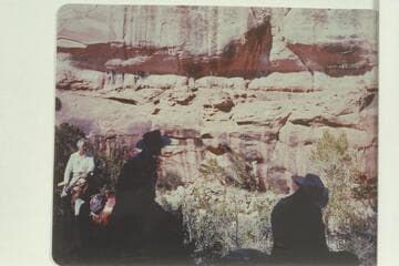 Trail on the ledge of Bridge Canyon.  John Doerr, at left, is riding the new trail on the other side of the canyon