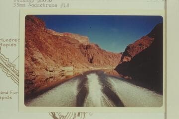 Downriver from Mile 238.  The cook house of Bridge Canyon City is below the side canyon at left bank