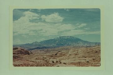 Navajo Mountain from Gray Mesa. Trail Canyon is at left and Cha Canyon is to the right of the two dark flat tops at lower left center