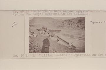 The barge or scow at the shore near the sluice box used to run the sample obtained in the drilling