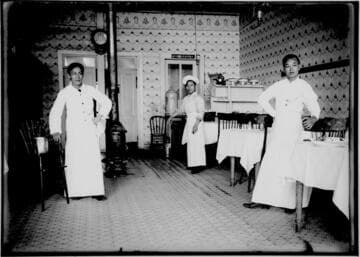 Three Chinese men inside a restaurant
