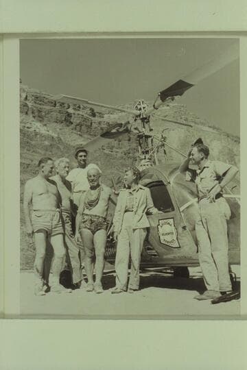 Boat party and pilot posed with helicopter; Tapeats Creek.  Left to right:  Taylor, Desloge, Forcier, Marston, Margaret Marston and Carson