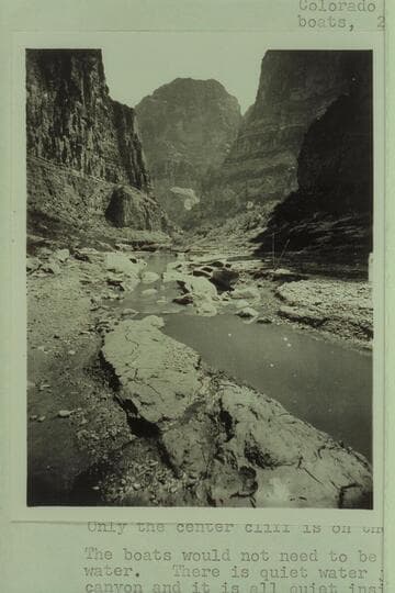 Kanab Canyon near mouth. Cliffs in distance right and left are on the other side of the Colorado River. The boats are the Powell boats. 2d Expedition